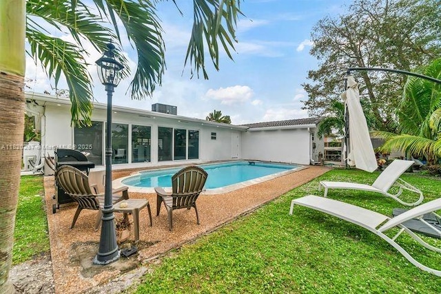 4140 N 36th Ave, Hollywood, FL 33021 - swimming pool with a patio and a lawn