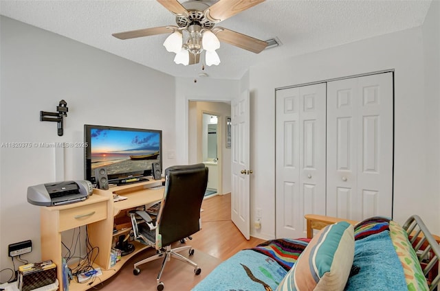 20865 NW 3rd Ln, Pembroke Pines, FL 33029 - office with light wood-type flooring, a textured ceiling, and a ceiling fan