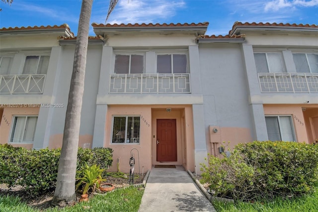 20865 NW 3rd Ln, Pembroke Pines, FL 33029 - view of property with stucco siding and a tiled roof
