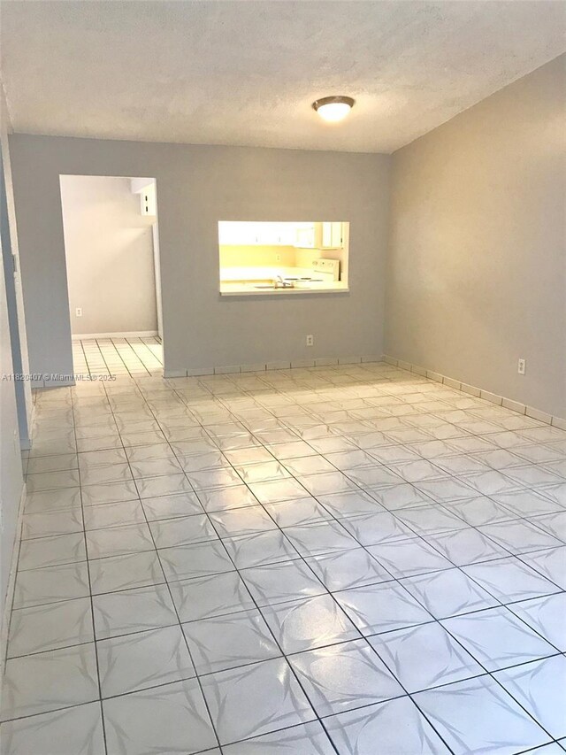 9810 Hammocks Blvd Unit 202, Miami, FL 33196 - empty room with a textured ceiling and baseboards