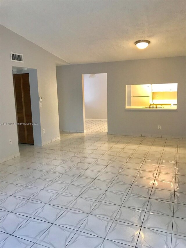 9810 Hammocks Blvd Unit 202, Miami, FL 33196 - unfurnished room featuring lofted ceiling