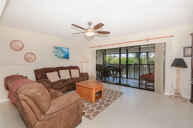 240 Captains Walk Unit 5110, Delray Beach, FL 33483 - living area with ceiling fan, light tile patterned floors, and a textured ceiling