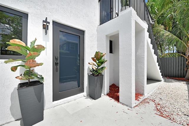 1805 SW 4th St, Miami, FL 33135 - doorway to property with stucco siding and a balcony