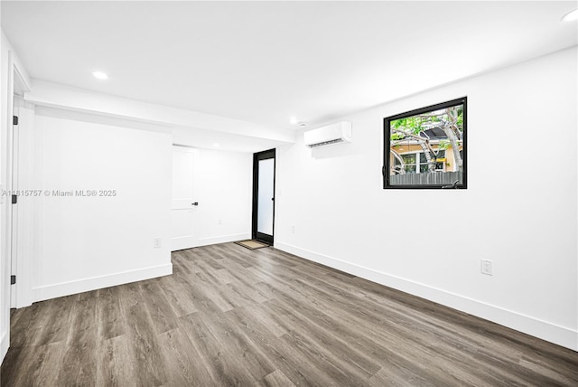 1805 SW 4th St, Miami, FL 33135 - empty room with an AC wall unit, wood finished floors, and recessed lighting