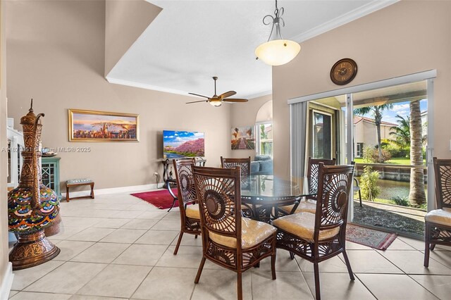1762 E Trafalgar Cir, Hollywood, FL 33020 - dining space featuring crown molding, light tile patterned floors, and ceiling fan