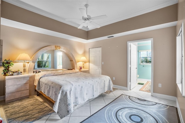 1762 E Trafalgar Cir, Hollywood, FL 33020 - bedroom featuring ornamental molding, light tile patterned floors, ceiling fan, and connected bathroom