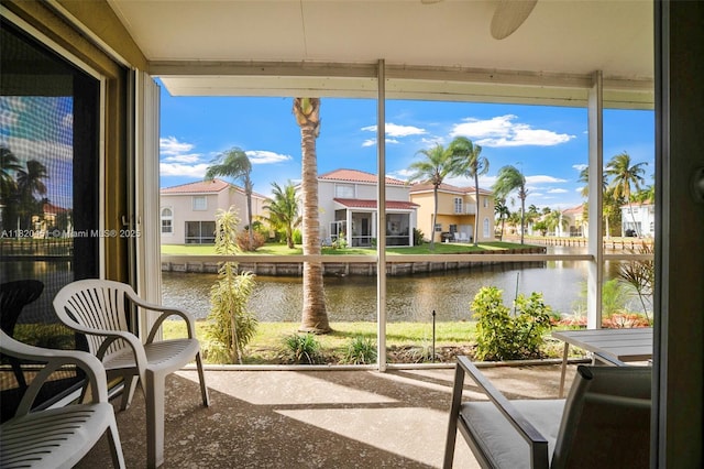 1762 E Trafalgar Cir, Hollywood, FL 33020 - sunroom / solarium featuring a water view, a residential view, and expansive windows