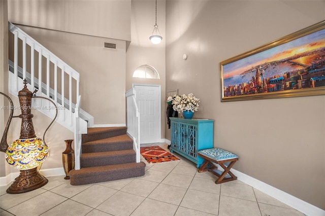 1762 E Trafalgar Cir, Hollywood, FL 33020 - entrance foyer featuring a towering ceiling, stairway, and tile patterned flooring
