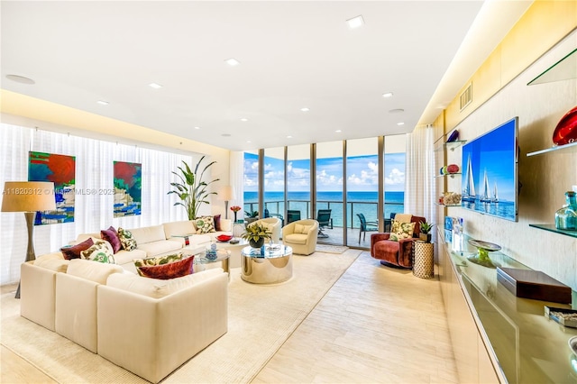 9705 Collins Ave Unit 1101N, Bal Harbour, FL 33154 - living area featuring floor to ceiling windows, a water view, wood finished floors, and recessed lighting