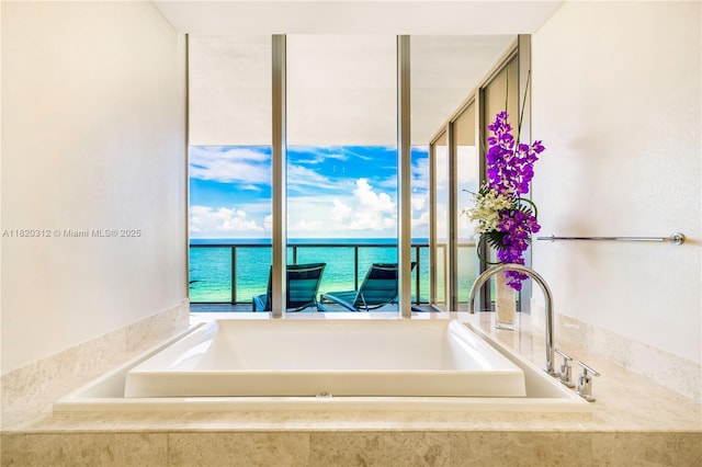9705 Collins Ave Unit 1101N, Bal Harbour, FL 33154 - bathroom with a garden tub and a water view