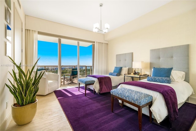 9705 Collins Ave Unit 1101N, Bal Harbour, FL 33154 - bedroom with access to outside, a chandelier, and wood finished floors