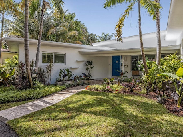1130 NE 91st Ter, Miami Shores, FL 33138 - view of front of property with stucco siding and a front yard