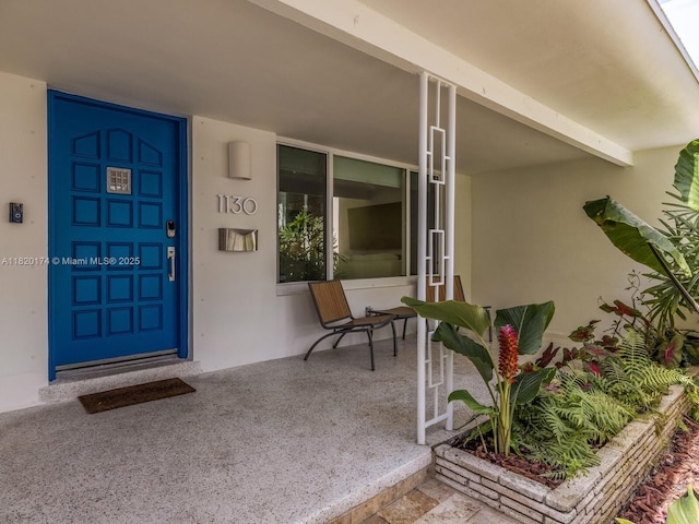 1130 NE 91st Ter, Miami Shores, FL 33138 - doorway to property with stucco siding
