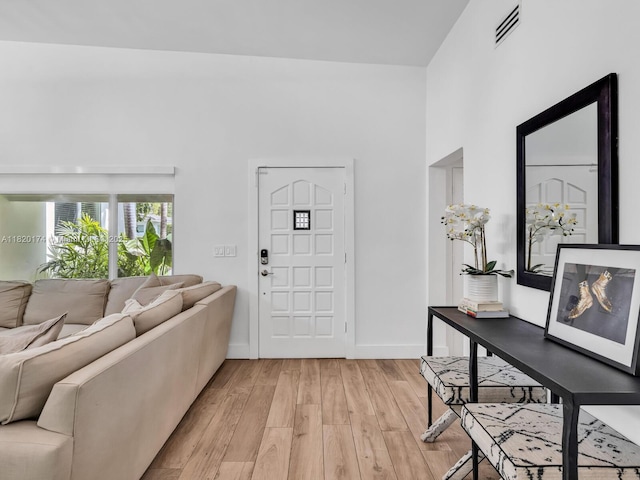 1130 NE 91st Ter, Miami Shores, FL 33138 - entrance foyer featuring light wood-style floors and baseboards