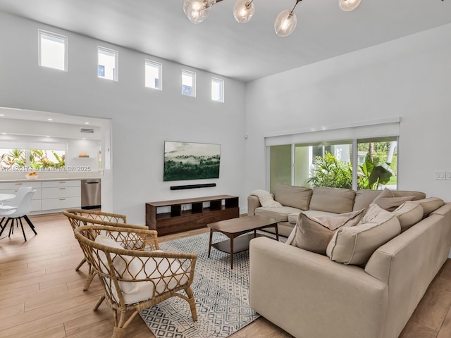 1130 NE 91st Ter, Miami Shores, FL 33138 - living room with a towering ceiling and light wood finished floors