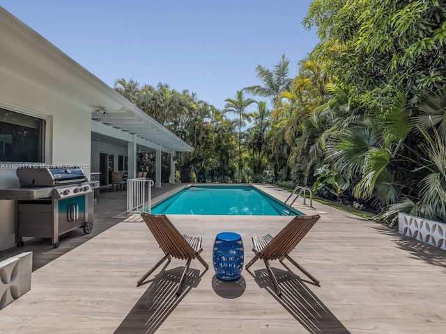 1130 NE 91st Ter, Miami Shores, FL 33138 - outdoor pool with a wooden deck and area for grilling
