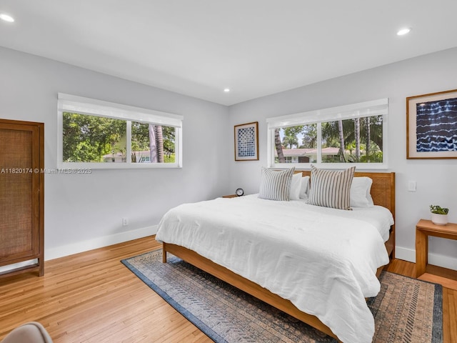 1130 NE 91st Ter, Miami Shores, FL 33138 - bedroom with multiple windows, recessed lighting, and light wood-style flooring