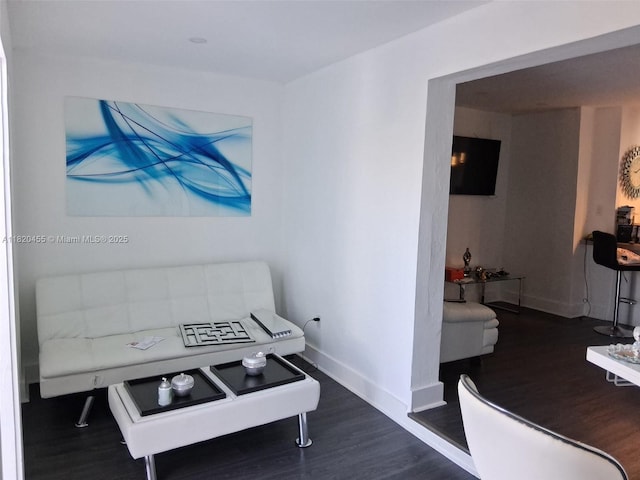 636 E 18th St, Hialeah, FL 33013 - interior space featuring dark wood-style flooring and baseboards