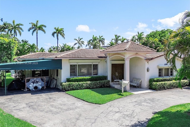 96 Bal Cross Dr, Bal Harbour, FL 33154 - view of front of property featuring a tile roof, stucco siding, and driveway
