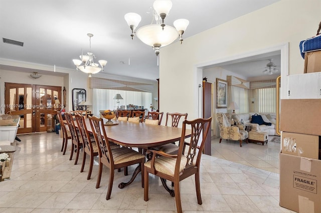 96 Bal Cross Dr, Bal Harbour, FL 33154 - dining space with a chandelier