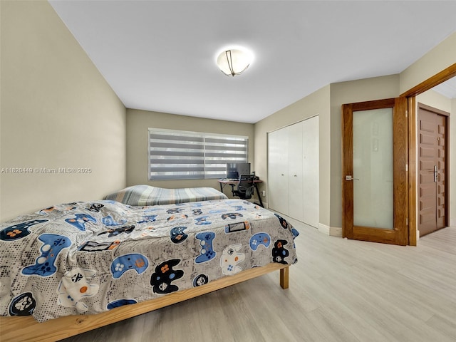 9933 NW 49th Ter, Doral, FL 33178 - bedroom with wood finished floors and a closet