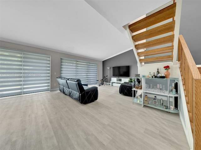 9933 NW 49th Ter, Doral, FL 33178 - living room featuring wood finished floors, vaulted ceiling, and crown molding