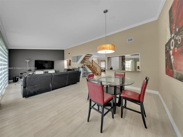 9933 NW 49th Ter, Doral, FL 33178 - dining area with stairs, crown molding, and wood finished floors
