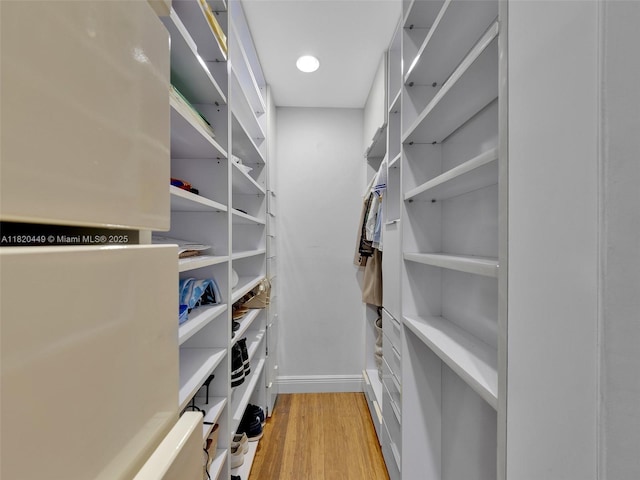 9933 NW 49th Ter, Doral, FL 33178 - walk in closet featuring light wood-type flooring