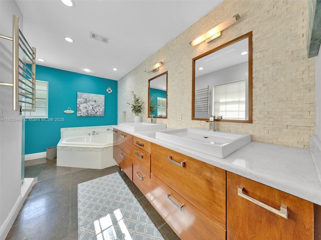 9933 NW 49th Ter, Doral, FL 33178 - bathroom featuring a bath, double vanity, and recessed lighting