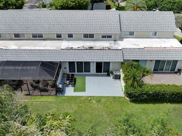 9933 NW 49th Ter, Doral, FL 33178 - rear view of property featuring a patio and a yard