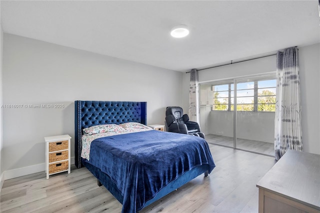 215 SE 3rd Ave Unit 303B, Hallandale Beach, FL 33009 - bedroom featuring light wood-type flooring and access to exterior
