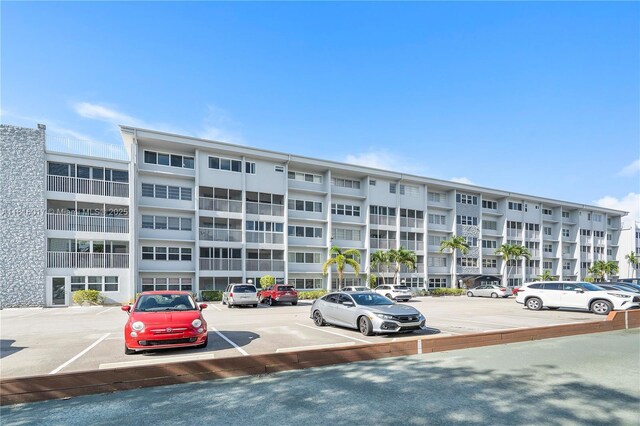 215 SE 3rd Ave Unit 303B, Hallandale Beach, FL 33009 - view of apartment building / complex with uncovered parking