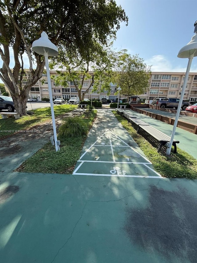 215 SE 3rd Ave Unit 303B, Hallandale Beach, FL 33009 - view of home's community featuring shuffleboard and a residential view