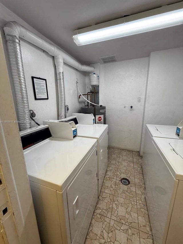 215 SE 3rd Ave Unit 303B, Hallandale Beach, FL 33009 - laundry room with washer and clothes dryer and electric water heater