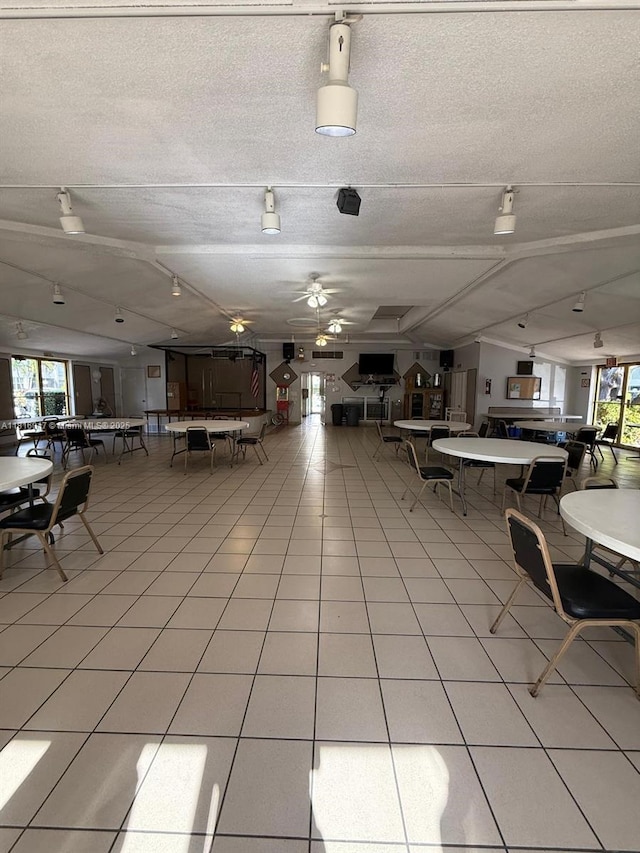 215 SE 3rd Ave Unit 303B, Hallandale Beach, FL 33009 - misc room featuring healthy amount of natural light, light tile patterned floors, a textured ceiling, and rail lighting