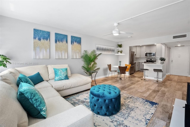 2781 Taft St Unit 308, Hollywood, FL 33020 - living area featuring light wood-type flooring and ceiling fan