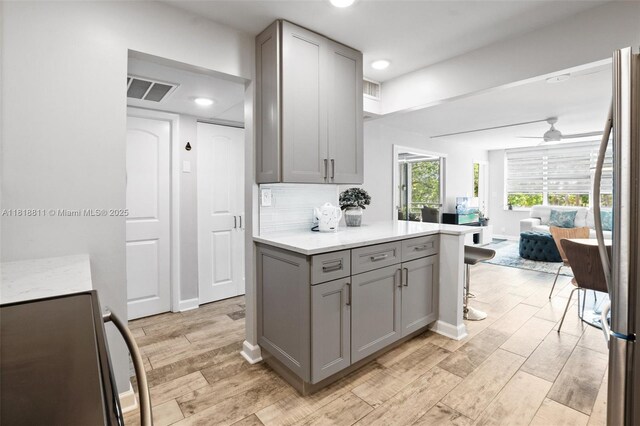 2781 Taft St Unit 308, Hollywood, FL 33020 - kitchen featuring gray cabinets, range, open floor plan, and recessed lighting