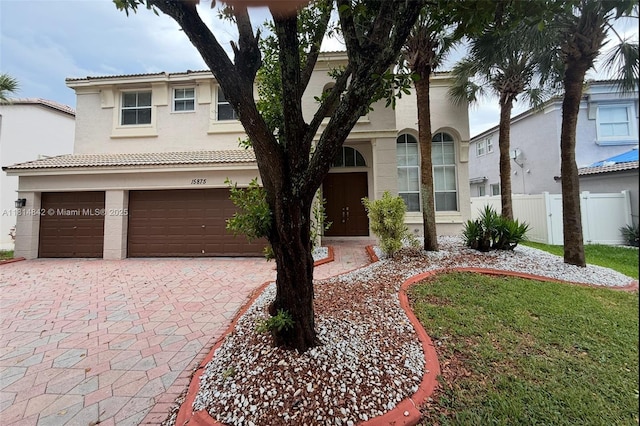 15875 SW 52nd St, Miramar, FL 33027 - view of front of property featuring stucco siding, driveway, and an attached garage