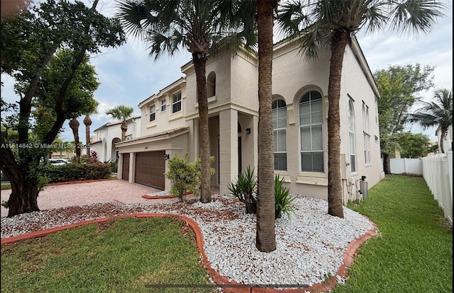 15875 SW 52nd St, Miramar, FL 33027 - mediterranean / spanish-style home with stucco siding, driveway, and an attached garage
