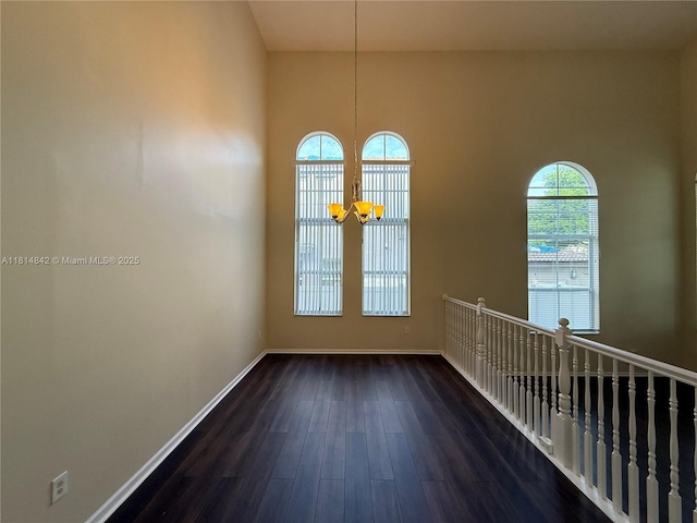 15875 SW 52nd St, Miramar, FL 33027 - empty room featuring dark wood-style flooring and a chandelier