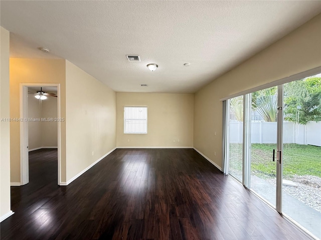 15875 SW 52nd St, Miramar, FL 33027 - unfurnished room featuring healthy amount of natural light, dark wood finished floors, a textured ceiling, a smoke detector, and a ceiling fan