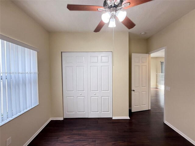 15875 SW 52nd St, Miramar, FL 33027 - unfurnished bedroom featuring a closet, dark wood finished floors, and ceiling fan