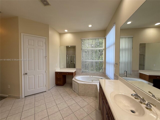 15875 SW 52nd St, Miramar, FL 33027 - full bathroom with a bath, two vanities, tile patterned floors, recessed lighting, and an enclosed shower