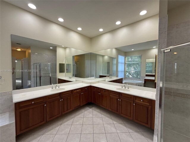 15875 SW 52nd St, Miramar, FL 33027 - full bathroom featuring tile patterned floors, a stall shower, a bath, vanity, and recessed lighting