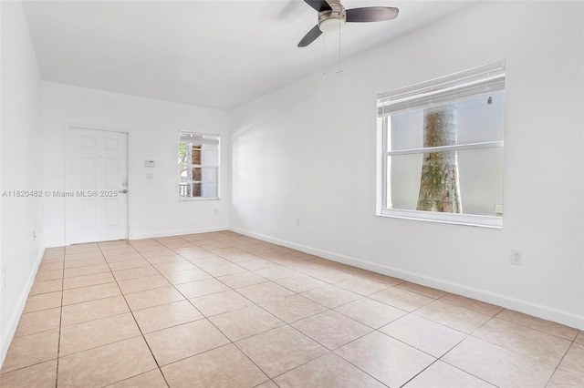 22569 SW 89th Pl, Cutler Bay, FL 33190 - spare room featuring light tile patterned flooring and ceiling fan