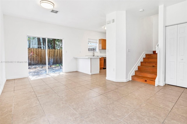 22569 SW 89th Pl, Cutler Bay, FL 33190 - unfurnished living room with stairway and light tile patterned flooring