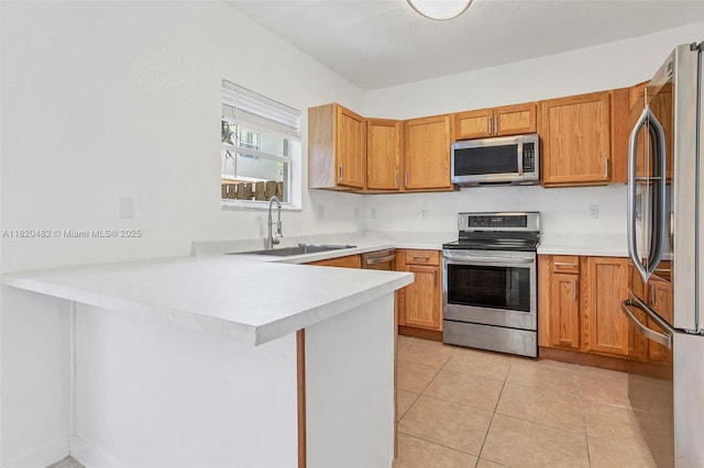 22569 SW 89th Pl, Cutler Bay, FL 33190 - kitchen with stainless steel appliances, a peninsula, light countertops, and light tile patterned flooring