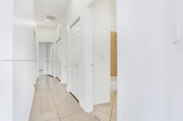 22569 SW 89th Pl, Cutler Bay, FL 33190 - corridor with light tile patterned flooring and baseboards