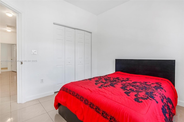 22569 SW 89th Pl, Cutler Bay, FL 33190 - bedroom featuring light tile patterned flooring and a closet