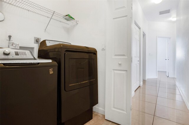 22569 SW 89th Pl, Cutler Bay, FL 33190 - laundry area featuring independent washer and dryer and light tile patterned floors